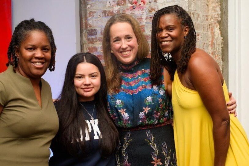 An image of Hilary Darilek with Lisa Carlton Waller (Board Chair), Candace Crawford (former Director of College Counseling), and an alumna.