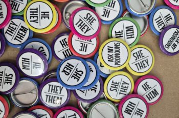 A stock image of different pronoun buttons.