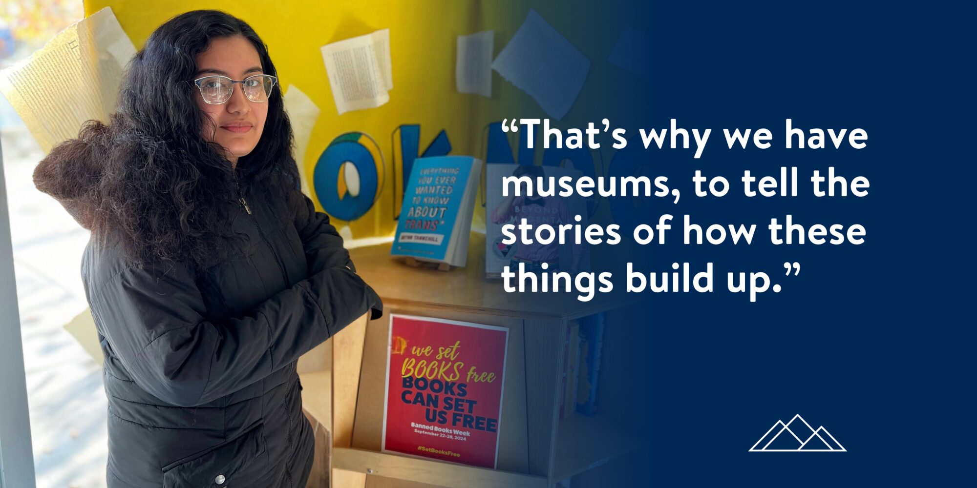 An image of Paris standing in front of a stack of banned books.