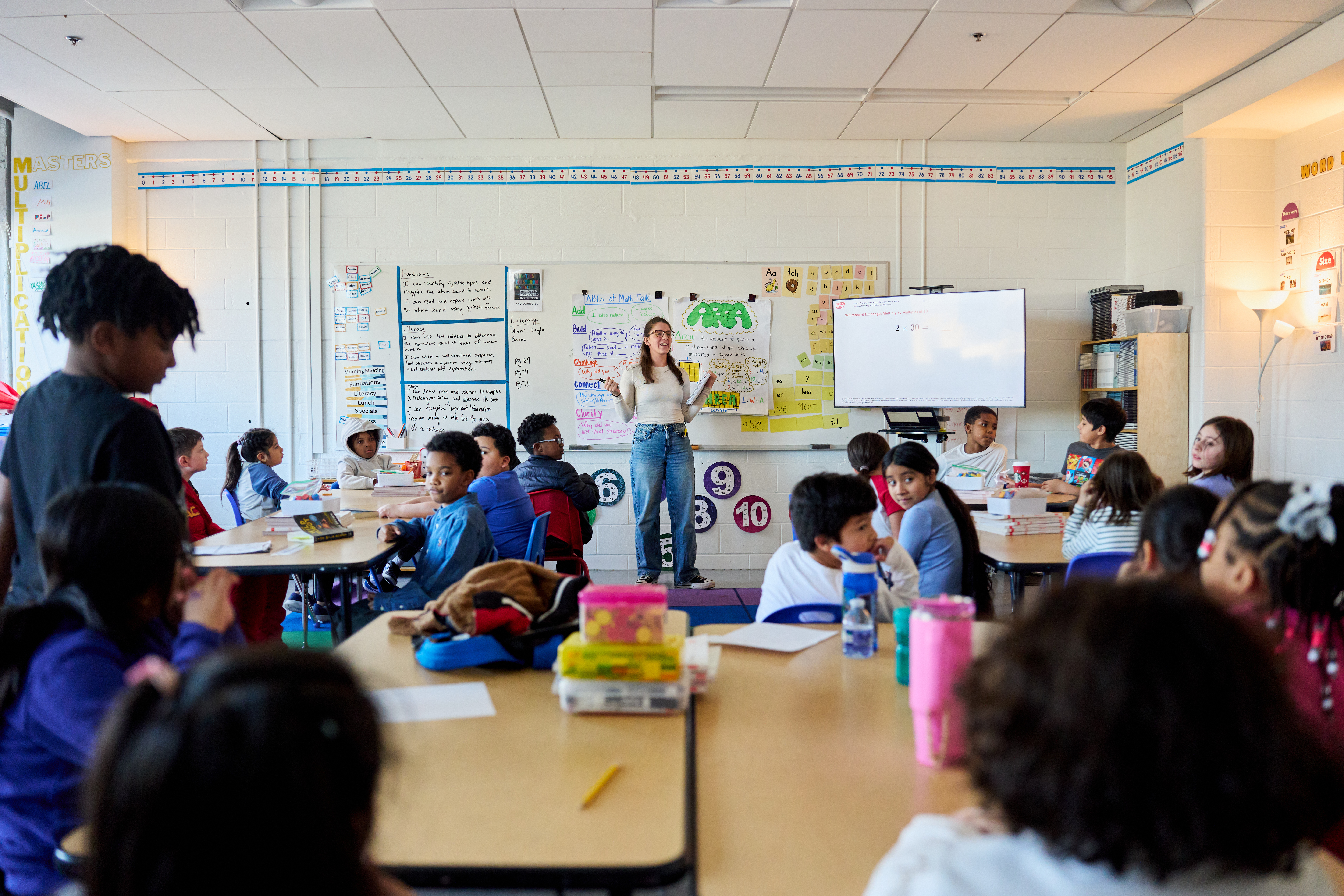 A photograph a bright and vibrant elementary school classroom.